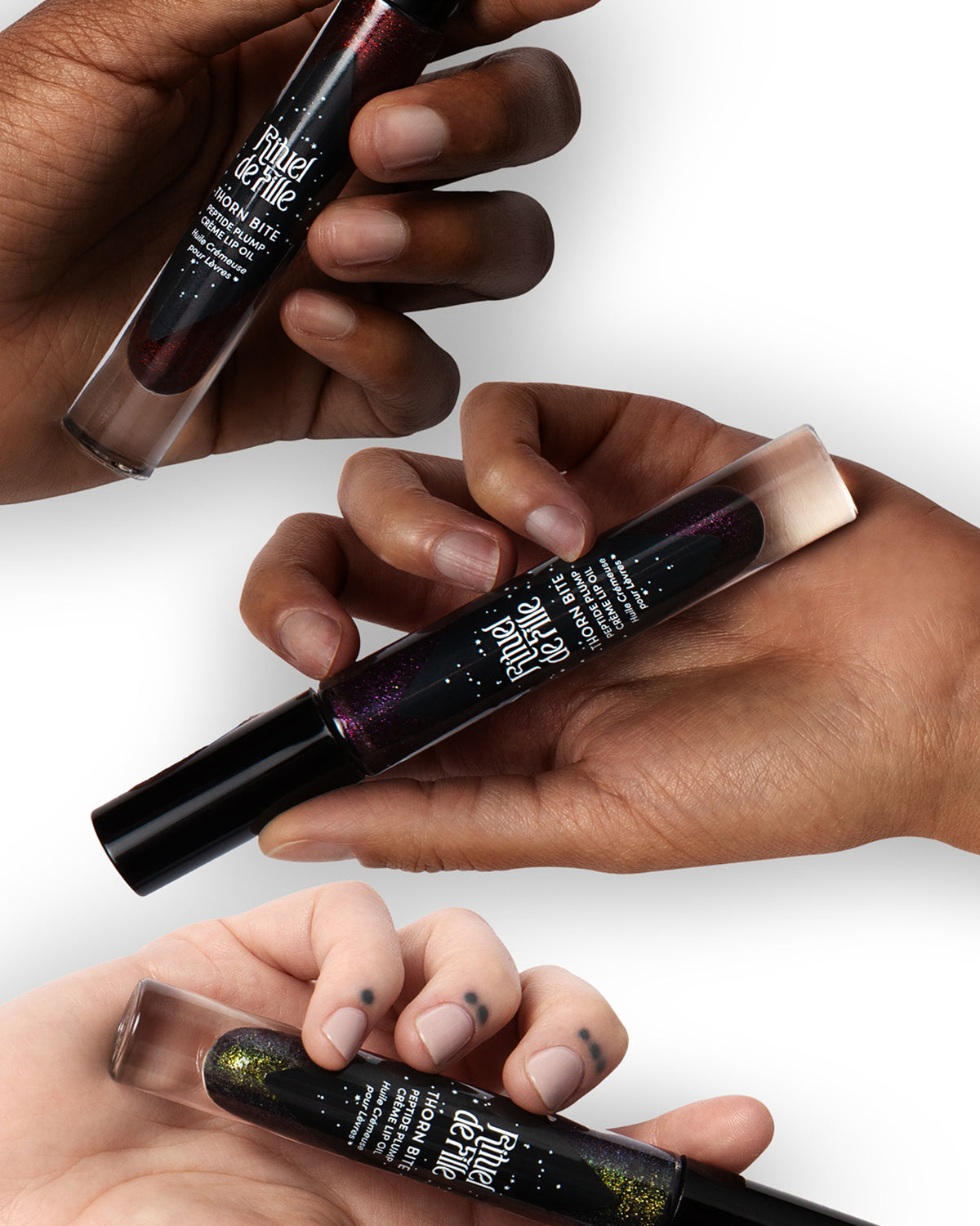 Three tubes of Chroma Obscura Thorn Bite lip oil 
